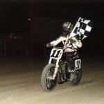 John Parker holding checkered flag