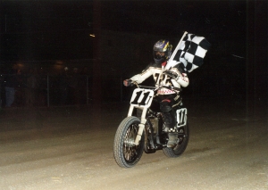 John Parker holding checkered flag